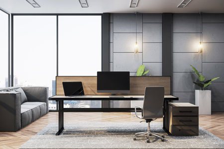 Stylish modern executive office with luxury desk, computer setup, gray walls, and large window overlooking the city. 3D Renderingの写真素材