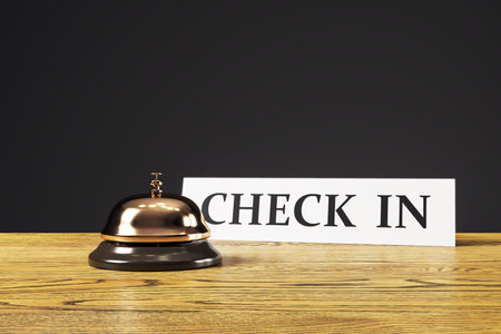 Hotel reception desk with a shiny service bell and a CHECK IN sign on wooden surface, realistic style, dark background, concept of hospitality. 3D Rendering.の写真素材