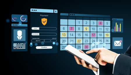 Businessperson using mobile device with digital calendar, payment form, and user interface on dark background, concept of online business techの写真素材