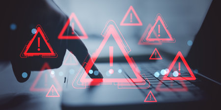 Red exclamation warning icons overlaying person pressing laptop button, digital style on blurred...