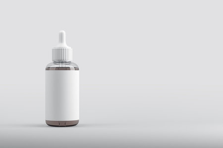 Transparent cosmetic dropper bottle with blank white label, 3D Rendering style, on a light gradient background. Concept of branding mockupの写真素材
