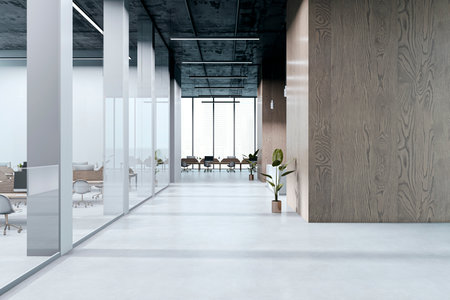 Empty modern office hallway with glass partitions, wood panel walls, and large windows in a clean corporate building interior. 3D Renderingの写真素材