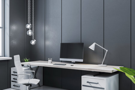 Sleek executive office workspace with a modern desk, computer, white chair, stylish lighting and dark paneled walls. 3D Renderingの写真素材