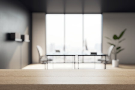Empty wooden tabletop closeup in modern office setting with blurred background, large window, and daylight, perfect for product presentation. 3D Renderingの写真素材