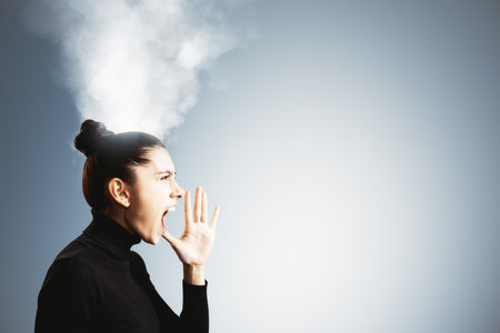 Angry businesswoman shouting with steam coming from her head, symbolizing stress and burnout, on a...