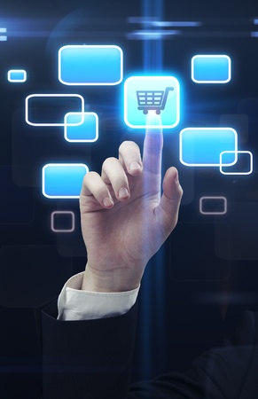  Young business man pressing a  trolley touchscreen buttonの写真素材