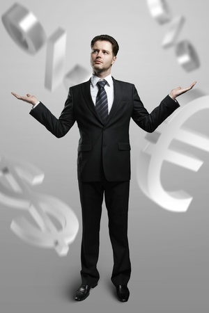 Successful businessman and currency symbolsの写真素材