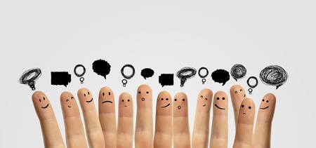 Happy group of finger smileys with social chat sign and speech bubbles  Fingers representing a...