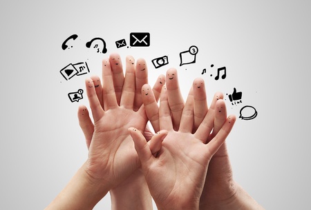 Happy group of finger smileys with social chat sign and speech bubbles,icons  Fingers representing a social network の写真素材