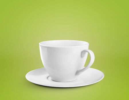 Coffee Cup with saucer on a green backgroundの写真素材