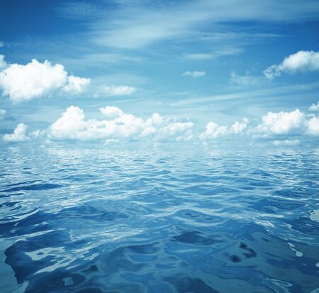 cloudy blue sky and sea surface great for backgroundの写真素材
