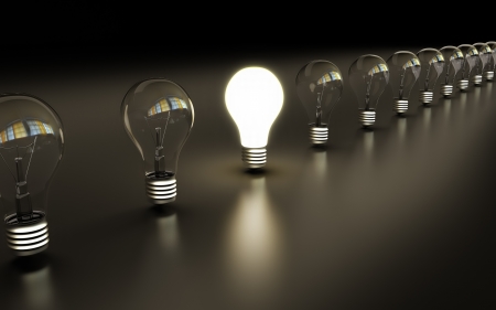 glow among other light bulb on a blue backgroundの写真素材