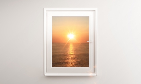 ocean sunset outside the windowの写真素材