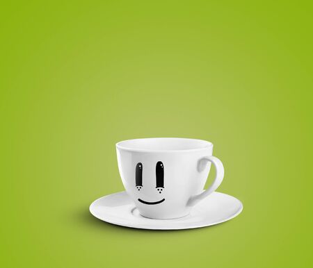 happy cup on a green backgroundの写真素材