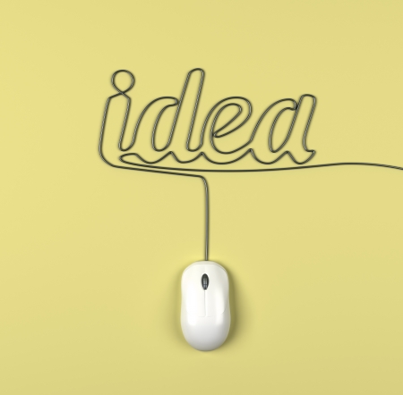 mouse and cables in form of idea on a yellow backgroundの写真素材