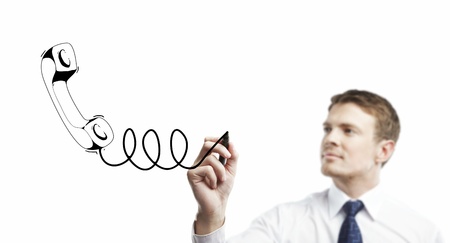 young man drawing handset on a white backgroundの写真素材