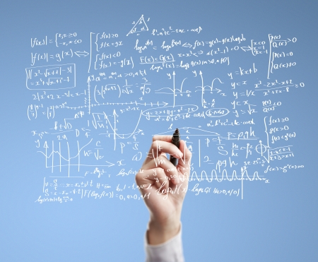 hand drawing mathematical formulas on a boardの写真素材