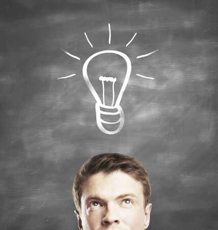 young man and drawing lamp in deskの写真素材