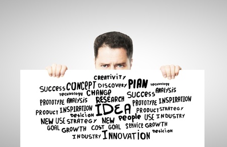 man holding poster business tagsの写真素材