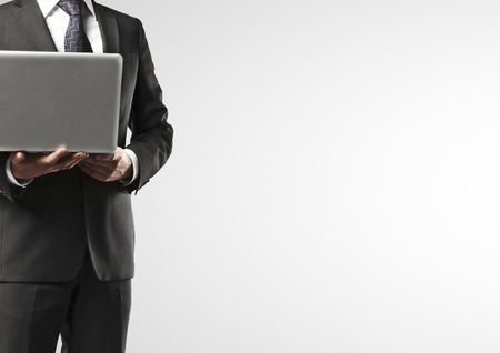 businessman with laptop on a white backgroundの写真素材