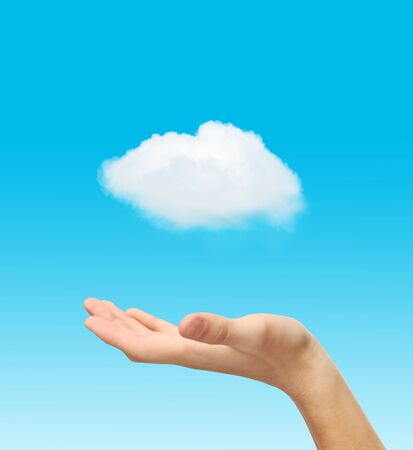 hand and white cloud on blue backgroundの写真素材