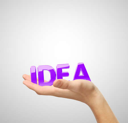 word idea in hand on white backgroundの写真素材