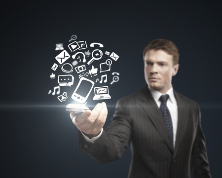 man holding interface with iconsの写真素材