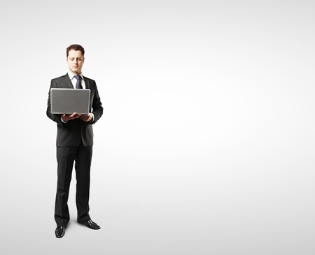 businessman with laptop on white backgroundの写真素材