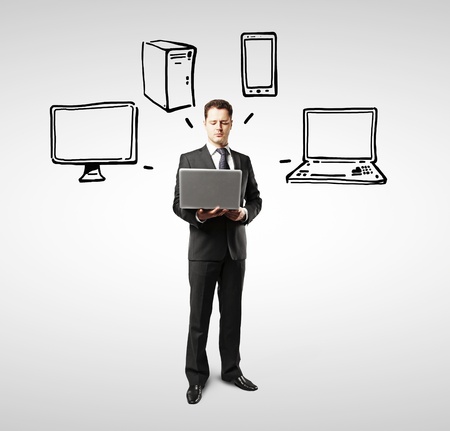 businessman dreaming about electronic gadgetsの写真素材