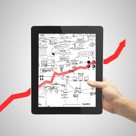 hand holding tablet  with business conceptの写真素材