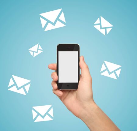 Hand holding  phone with email symbolの写真素材
