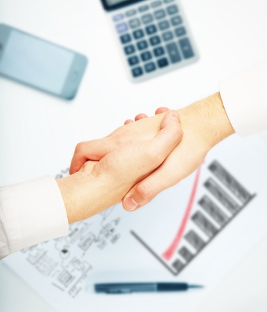 handshake on desktop background businessmanの写真素材