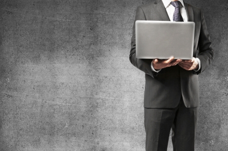 man with notebook in concrete roomの写真素材