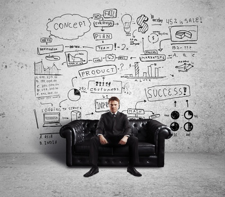 businessman sitting on couch and Global Concept Wallの写真素材