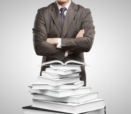 Businessman and open books  on white backgroundの写真素材