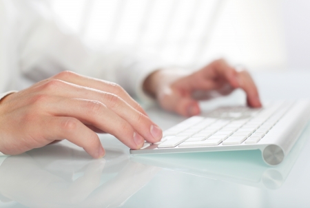 hand  typing on a keyboardの写真素材