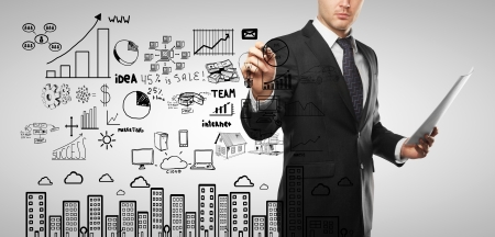 businessman drawing business concept on a white backgroundの写真素材