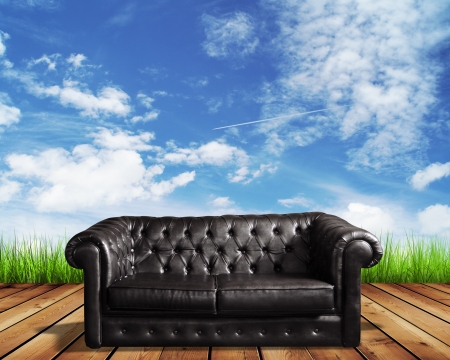 leather sofa on wooden floor and blue skyの写真素材