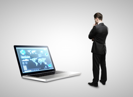 man seeing on notebook with interface screenの写真素材