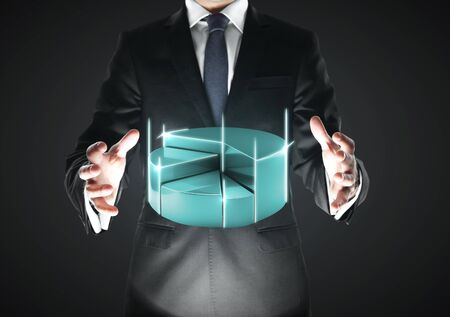 businnessman with procent pie on a black backgroundの写真素材