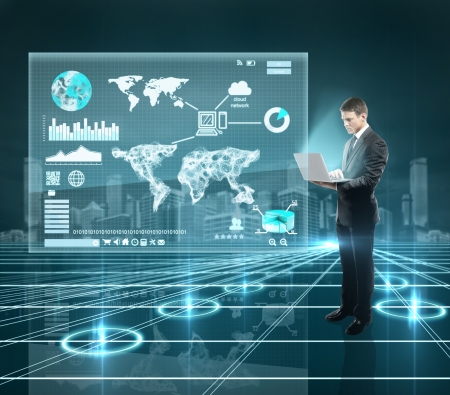 businesman standing in interface world with notebookの写真素材