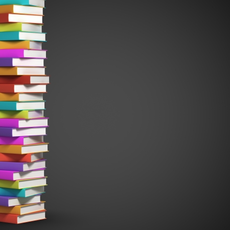 stack of colorful books on black backgroundの写真素材