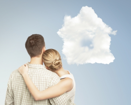 young couple and white cloud houseの写真素材
