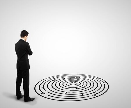 businessman standing and looking to labyrinthの写真素材