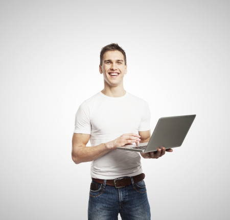 smiling men with laptop on white backgroundの写真素材