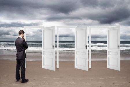 man standing on beach and opened doorsの写真素材