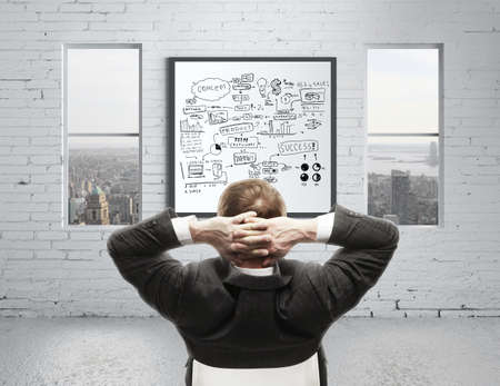 businessman in office and graphs conceptの写真素材