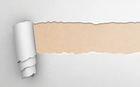 Torn paper with yellow backgroundの写真素材