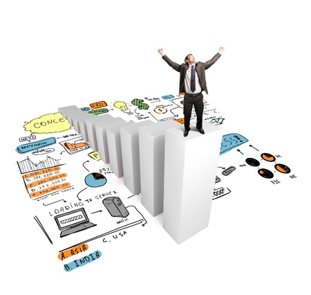 happy man standing on column with drawing conceptの写真素材