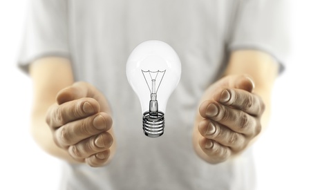 man with lightbulb on white backgroundの写真素材